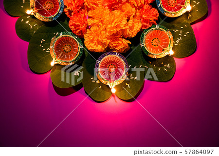 Happy Dussehra. Clay Diya lamps lit Indian Festival concept. Happy Dussehra. Clay Diya lamps lit Indian Festival concept. 57864097