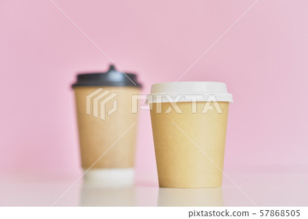 Two paper coffee cups on a pink background. Creative mockup image 57868505
