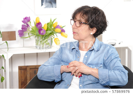 portrait of brunette mature woman with glasses 57869976