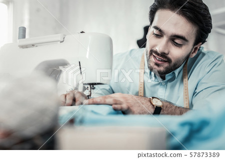 Attentive young tailor creating his summer collection 57873389