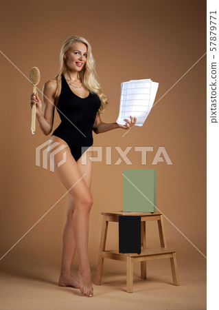 beautiful woman making a scrub massage with big brush. beautiful woman making a scrub massage with big brush. 57879771