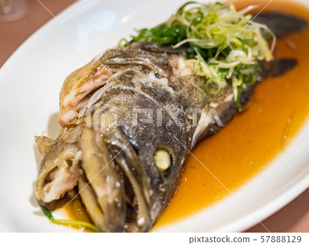 Fish in soy sauce, served on white plate Fish in soy sauce, served on white plate 57888129