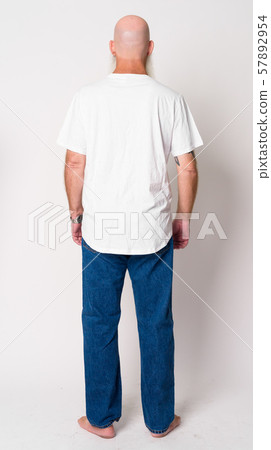 Full body shot rear view of mature bald man with long gray beard Full body shot rear view of mature bald man with long gray beard 57892954