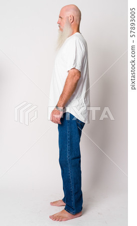 Full body shot profile view of mature bald man with long gray beard 57893005