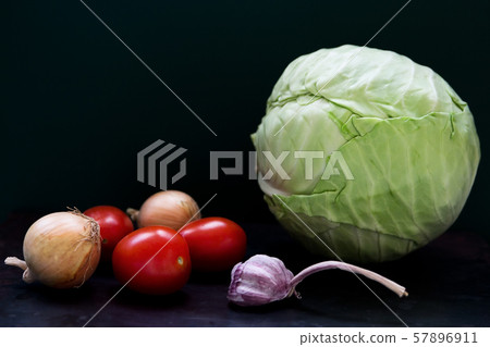 Raw vegetables on dark background 57896911