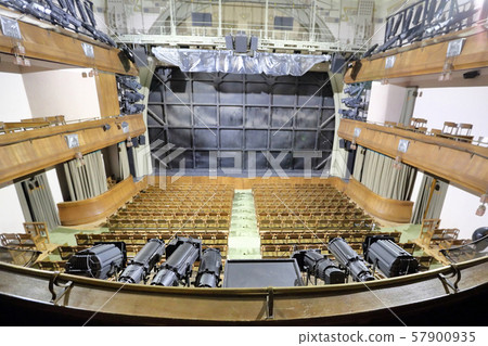Wooden seats in an empty theater hall Wooden seats in an empty theater hall 57900935