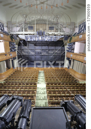 Wooden seats in an empty theater hall Wooden seats in an empty theater hall 57900939