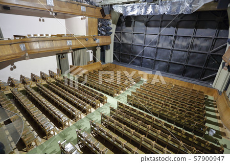 Wooden seats in an empty theater hall Wooden seats in an empty theater hall 57900947