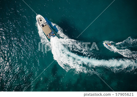 Aerial photo of man practicing wakeboarding Aerial photo of man practicing wakeboarding 57905621