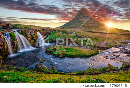 Beautiful landscape with sunrise on Kirkjufellsfoss waterfall and Kirkjufell mountain, Iceland. Beautiful landscape with sunrise on Kirkjufellsfoss waterfall and Kirkjufell mountain, Iceland. 57906846
