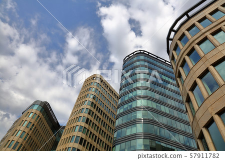 Modern city skyscrapers on sky background Modern city skyscrapers on sky background 57911782