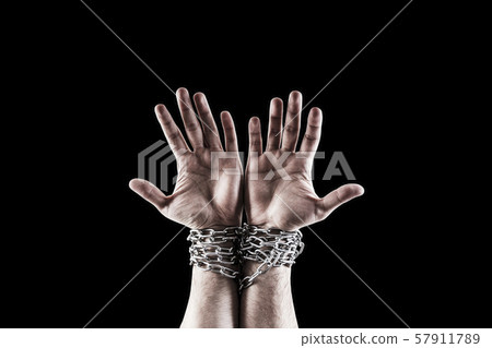Two hands in chains isolated on black background with clipping path Two hands in chains isolated on black background with clipping path 57911789
