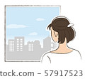 A woman looking out the window 57917523