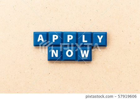 Tile letter in word apply now on wood background 57919606