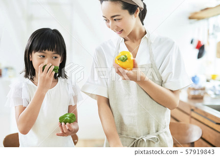 Parent and child mother daughter cooking 57919843