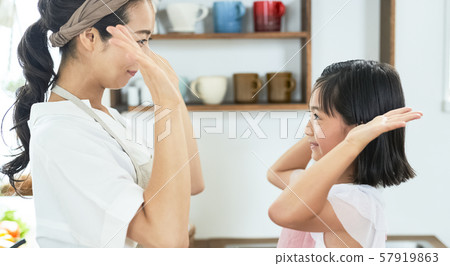 Parent and child mother daughter cooking 57919863
