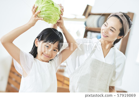 Parent and child mother daughter cooking 57919869
