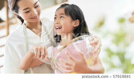 Parent and child mother daughter cooking 57919891