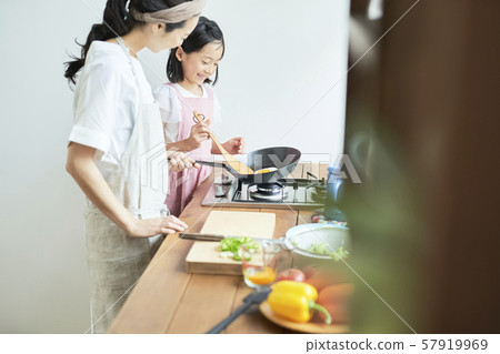 Parent and child mother daughter cooking 57919969