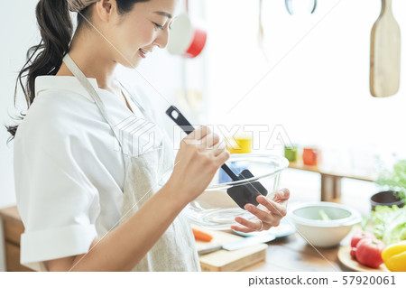 Female housewife cooking 57920061