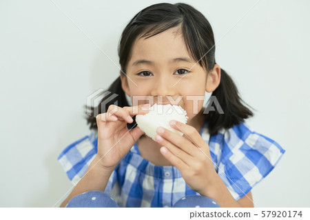 Girl child eating 57920174