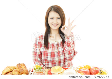 A woman enjoying a meal 57922233