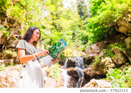 Happy young woman in mountains in the background of fog 57922313