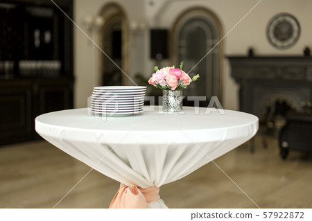 A small auxiliary table in the restaurant, on 57922872
