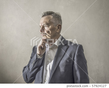 businessman with thoughtful expression businessman with thoughtful expression 57924127