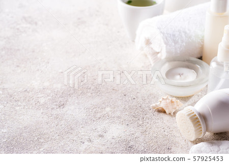 White cosmetics face care frame with tea set on light stone background . Clean beauty concept White cosmetics face care frame with tea set on light stone background . Clean beauty concept 57925453