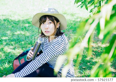 Woman drinking tea outside 57925577