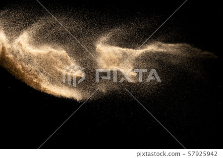 Dry river sand explosion isolated on black background. Abstract sand cloud.Brown colored sand splash against dark background. Dry river sand explosion isolated on black background. Abstract sand cloud.Brown colored sand splash against dark background. 57925942