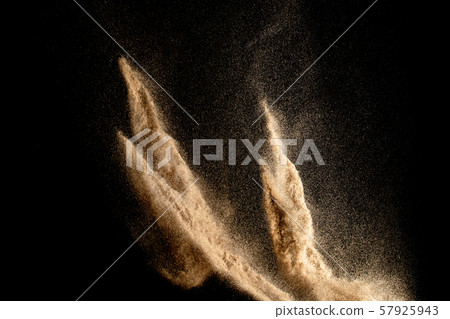 Dry river sand explosion isolated on black background. Abstract sand cloud.Brown colored sand splash against dark background. Dry river sand explosion isolated on black background. Abstract sand cloud.Brown colored sand splash against dark background. 57925943
