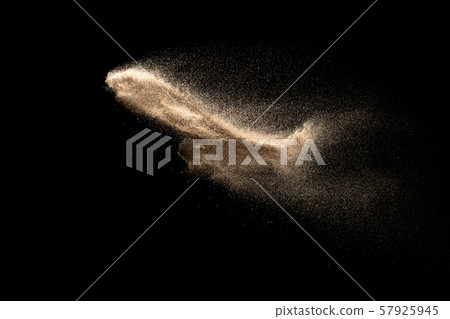 Dry river sand explosion isolated on black background. Abstract sand cloud.Brown colored sand splash against dark background. Dry river sand explosion isolated on black background. Abstract sand cloud.Brown colored sand splash against dark background. 57925945