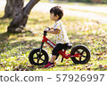 Bicycle with fallen leaves and kids 57926997