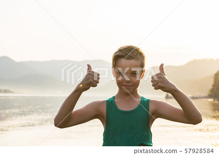 Closeup portrait of a boy on Teletskoye lake 57928584