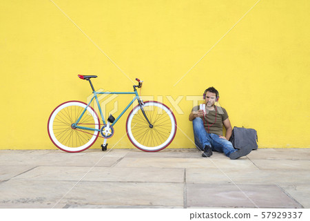Front view of an attractive guy sitting on the Front view of an attractive guy sitting on the 57929337