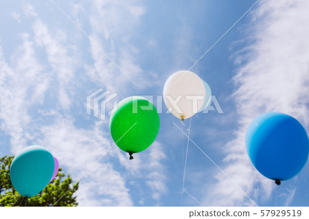 group multi colored balloons ribbons outside sky 57929519