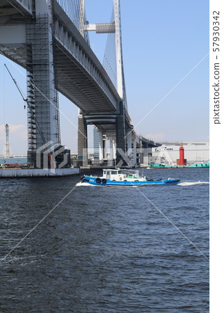 Yokohama Bay Bridge and ships passing underneath Yokohama Bay Bridge and ships passing underneath 57930342