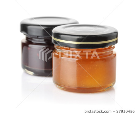 Small glass jars of apricot and blueberry jam Small glass jars of apricot and blueberry jam 57930486