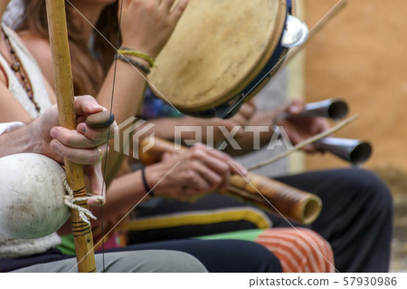 Berimbau and others instruments players during Berimbau and others instruments players during 57930986
