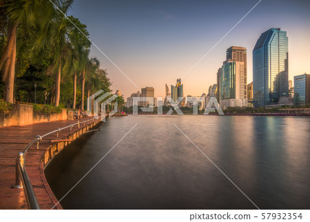 Lake with Wooden Walk Way in City Park 57932354