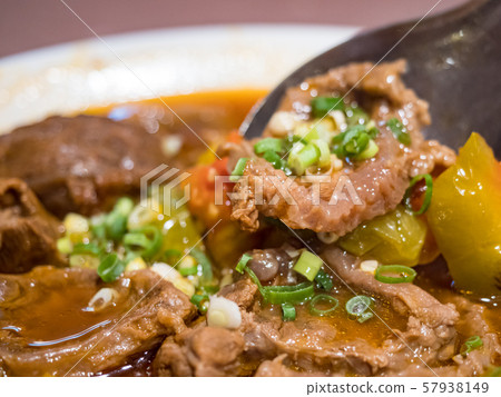 Baked beef stew with tomato 57938149