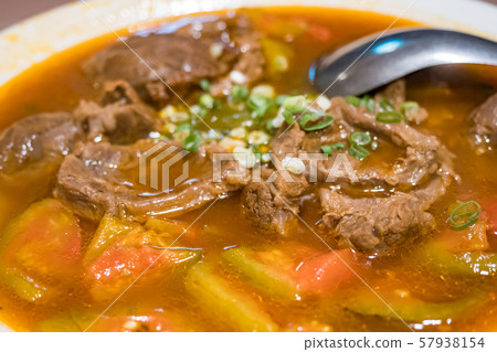 Baked beef stew with tomato 57938154