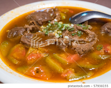 Baked beef stew with tomato 57938155