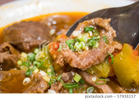 Baked beef stew with tomato Baked beef stew with tomato 57938157