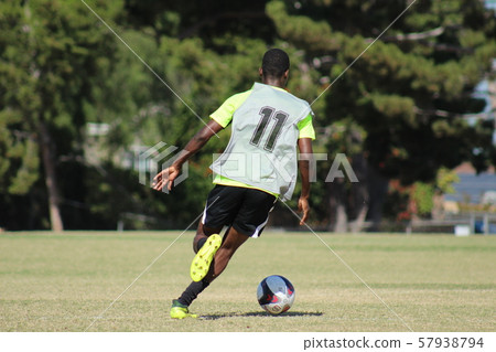 Foreign soccer player dribble scene 57938794