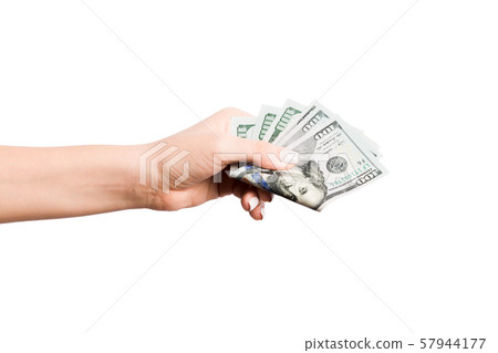 Isolated image of female hand holding a bundle of 57944177