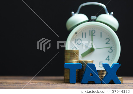 Time to pay TAX concept. TAX alphabet with stack 57944353