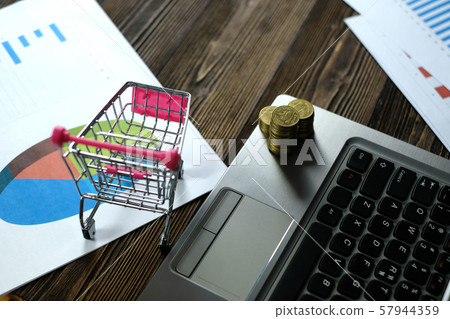 Step of coins stacks with trolley and notebook Step of coins stacks with trolley and notebook 57944359